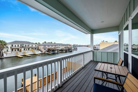 Your private balcony offers stunning waterfront views where you can savor morning coffee while watching boats drift by the scenic harbor.