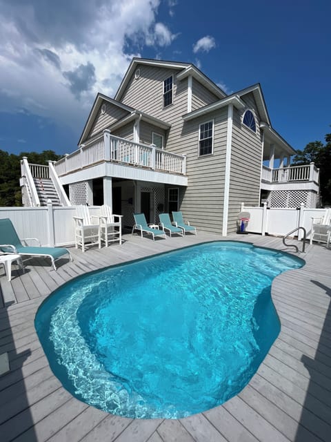Back/side of house showing large saltwater pool