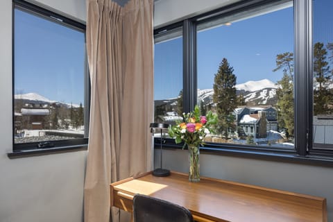 King bed, SmartTV, desk and chair, dressing mirror, huge closet, and en-suite bathroom with soaking tub, walk-in shower, double vanity, and a built-in towel warmer.