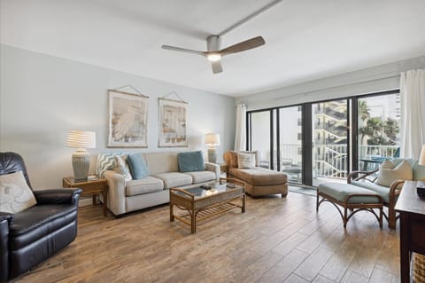 The living room is spacious and has plenty of seating, making it a perfect spot for a relaxing day.