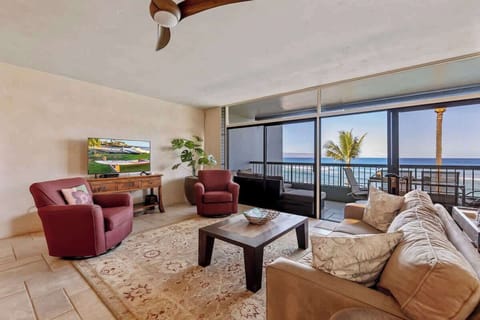 Stunning ocean view from the living area in this private corner condo.