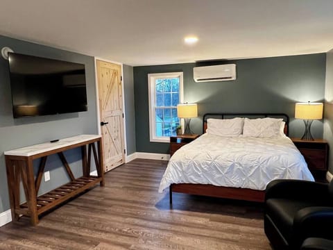 TV on adjustable mount pulls out to face bed