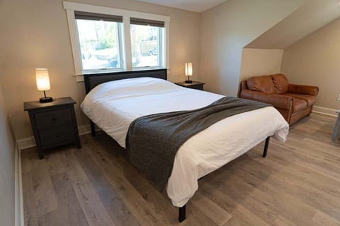 Cozy bedroom with queen bed and soft lighting