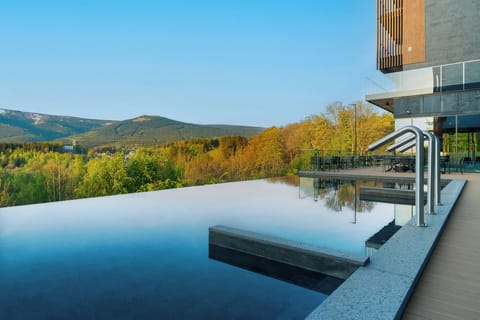Indoor pool, outdoor pool, sun loungers, lifeguards on site