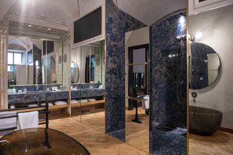 Shower, rainfall showerhead, designer toiletries, hair dryer