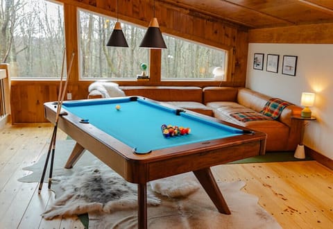 Custom Imperial pool table in loft. Full size sofa can sleep 2.