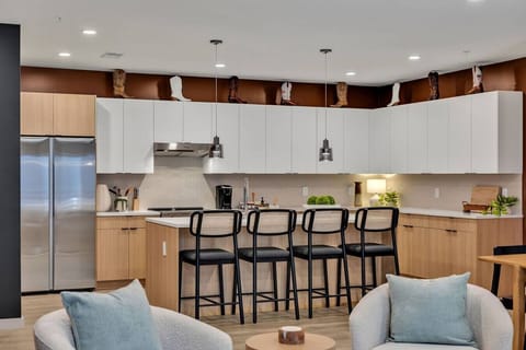 Fully stocked kitchen with stainless steel appliances and everything you`d need to make a home cooked meal