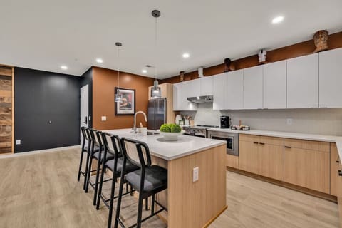 Fully stocked kitchen with stainless steel appliances and everything you`d need to make a home cooked meal