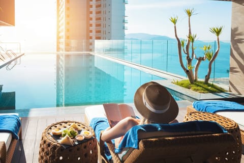 Outdoor pool, open 6:00 AM to 10:00 PM, pool umbrellas, sun loungers