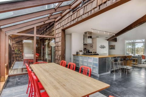 Open-concept living! Flow from the glass-roofed dining to the stylish kitchen & comfy lounge.