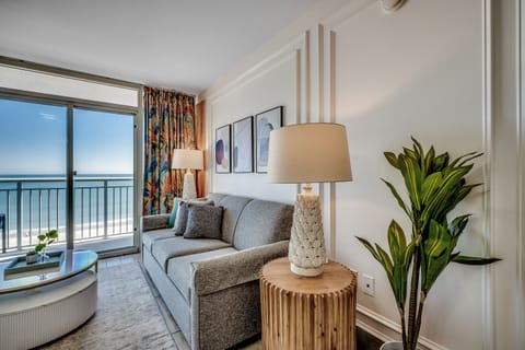 A modern living room with ocean views and stylish decor.