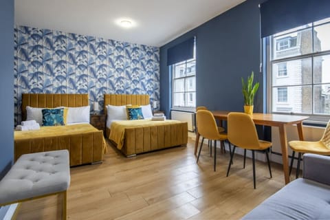 Room 1 has 2 queen-size bed and a sofa bed, it can fit up to 6 people.