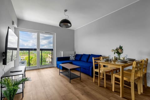 Comfortable Living Room with Sofa Bed and Smart TV | Book Now with RENTUJEMY