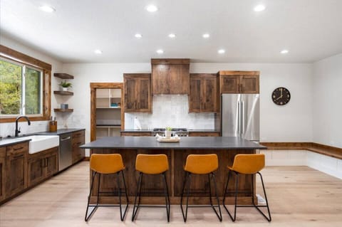Warm woods meet modern comfort this kitchen is both stylish and practical