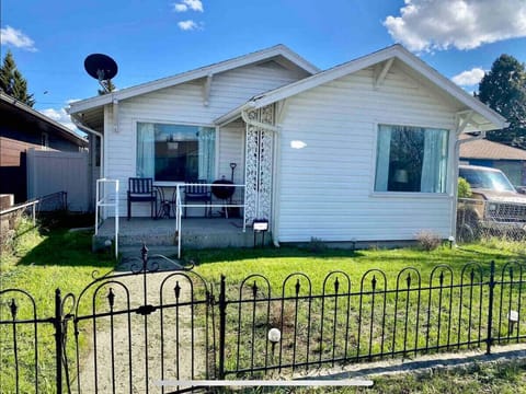 Fully fenced yard with wrought iron fence