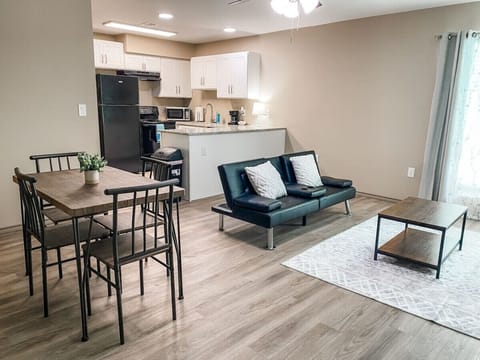 Dine or lounge in our open concept living room, kitchen, and dining room