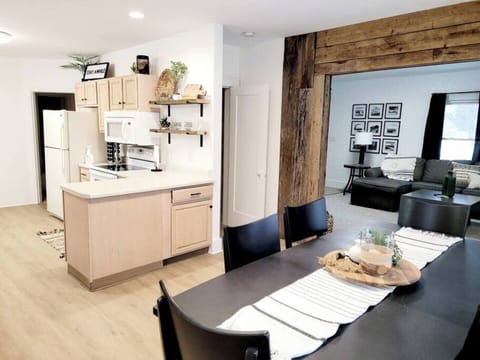 Main Floor. There is a master bedroom and full bathroom on the other side of this area. More chairs are in the closet and patio has seating for 16.