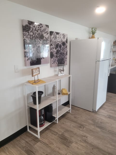 This is a little bar area by the dining table and kitchen. Both kinds of coffee pots are offered. We do provide a few pods but bring your own if you have a specific type you need. 