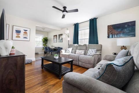 Unwind in the inviting living room, complete with a cozy sectional for family and friends to gather.