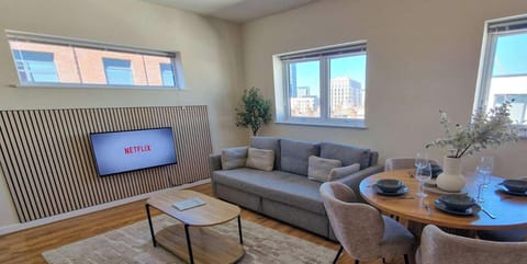 Settle into your stylish open plan living space with free parking, smart TV and stunning city views