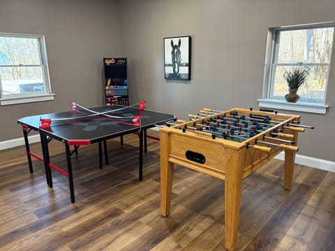 4 person ping pong and foosball in the game room