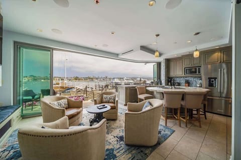 Floor-to-ceiling, wall-to-wall sliding glass doors & views of Newport Bay