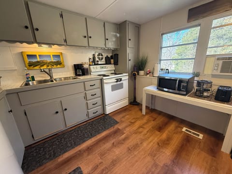 Compact, functional kitchen ideal for simple meals and coffee