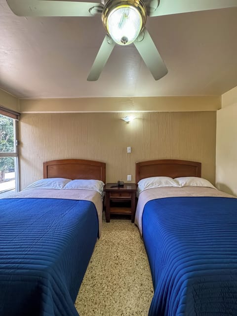 Standard Room, 2 Queen Beds | Individually decorated, individually furnished, desk, laptop workspace