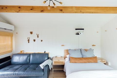 Cozy tiny retreat with warm wood accents and relaxing, homey touches.
