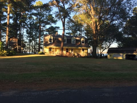 1 acre lake front property, tree house, and detached garage (game room).