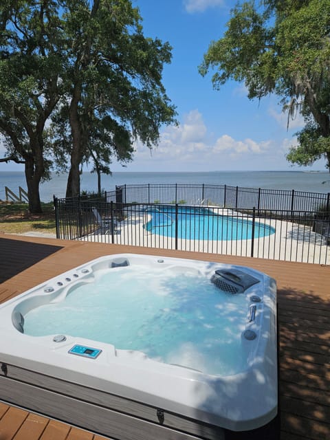 View from swing over hot tub and pool