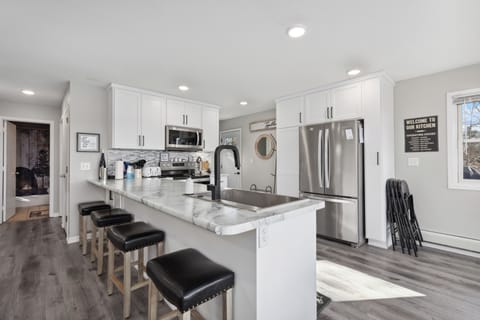 The breakfast bar includes four stools.