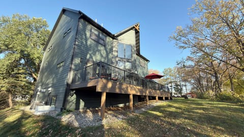 View of back of house and expansive deck