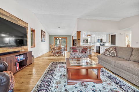 The living room opens up to the dining room and kitchen.