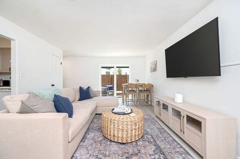 Cozy living room with a 55-inch TV, perfect for enjoying time with friends and family.