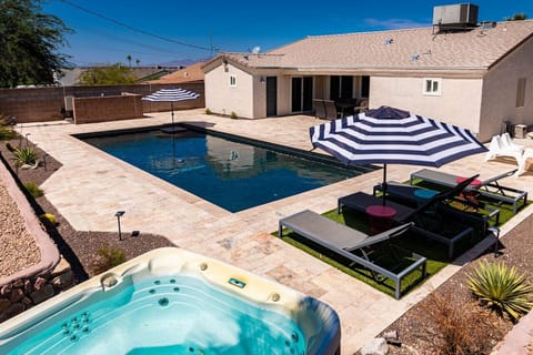 Enjoy the sparkling pool, unwind in the soothing hot tub, and soak up the sun on the spacious patio.