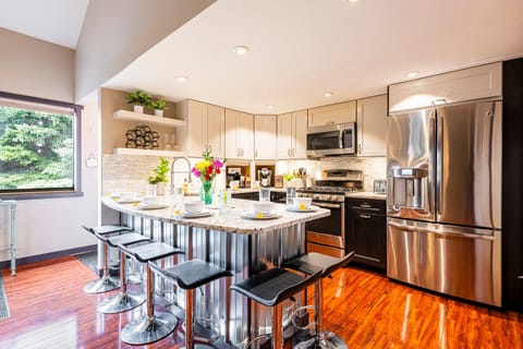 Spacious kitchen with bar seating for six