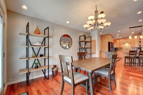 Dining area with table and 4 chairs. Extra seating for 4 at kitchen island.