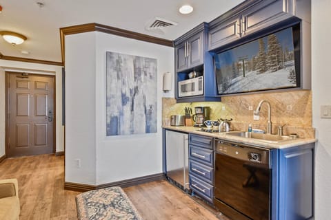 Kitchenette and flatscreen TV.