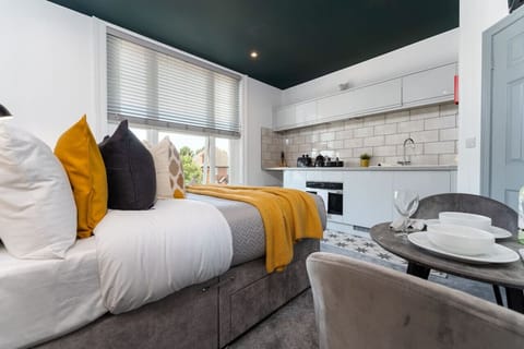 Studio apartment with full kitchen and seating space