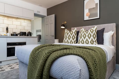 Comfortable bed with high quality linen and soft furnishings
