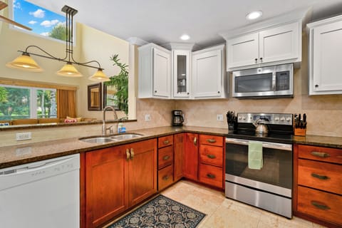 Kitchen opens to living room.