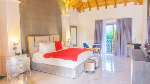 Deluxe Room, 1 King Bed, Garden View | In-room safe, individually decorated, individually furnished