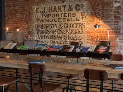 Historic character shines through in the hotel's lobby with brick walls and antique decor