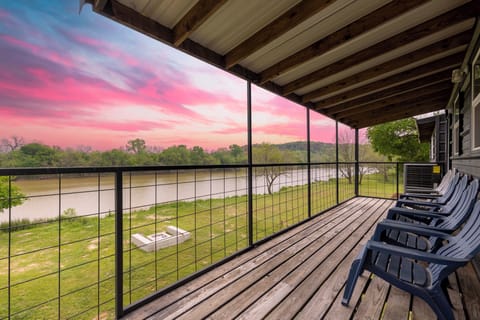 enjoy morning coffee or unwind after dinner with this riverfront view 