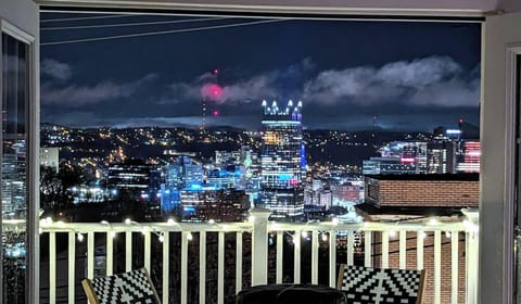 Iconic Pittsburgh skyline views from the rooftop deck—stunning day & night