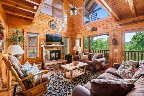 Beautifully designed living room area with a large Smart TV, fireplace and plenty of comfortable seating for your entire group.
