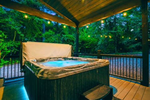 Soak under the stars in your private, tree-lined hot tub