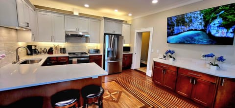 Spacious chef's kitchen, great for entertainng and note the huge Smart TV :-)