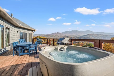Relax in the bubbling hot tub with stunning mountain views.